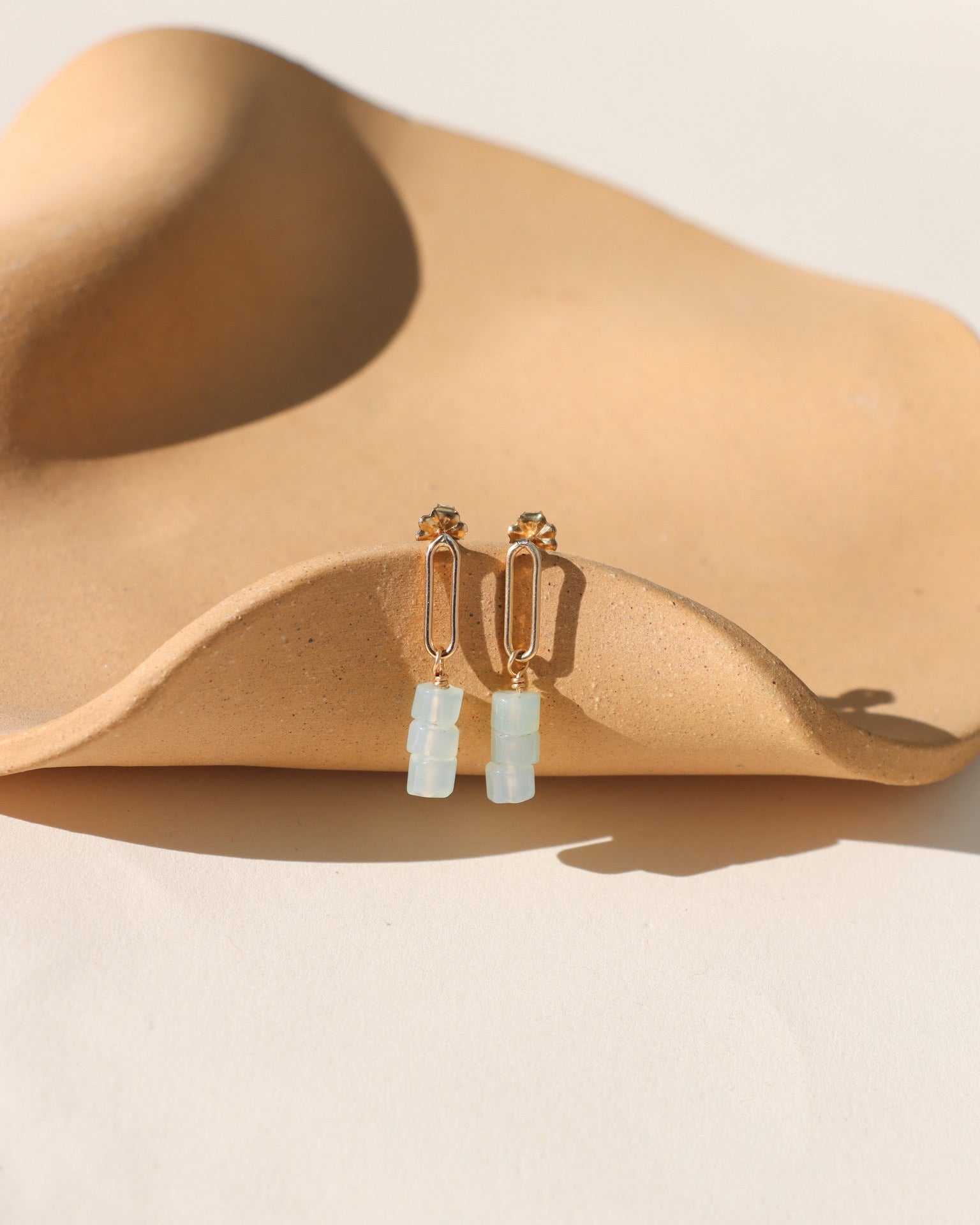 Selene Drops featuring pale green-blue chalcedony beads suspended from a slender oval in gold fill