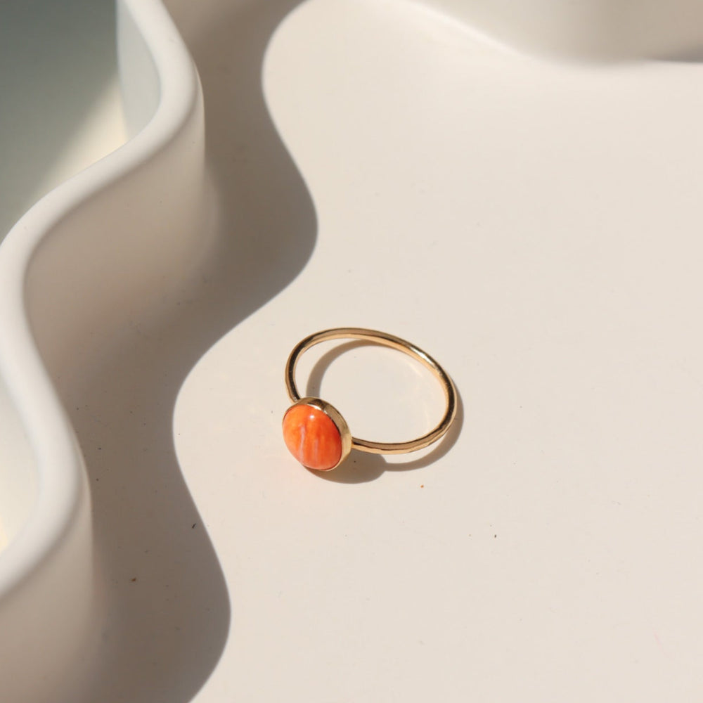 Sienna Ring featuring a vibrant spiny oyster gemstone on a hand-hammered  sterling silver band.