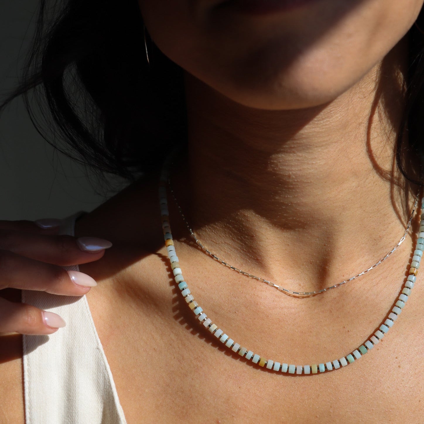 model wearing sterling silver chain necklace with amazonite beaded necklace