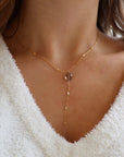 Delicate gold lariat necklace featuring a smooth smoky quartz pendant on the Sunspell chain, handcrafted for a warm, minimal look.