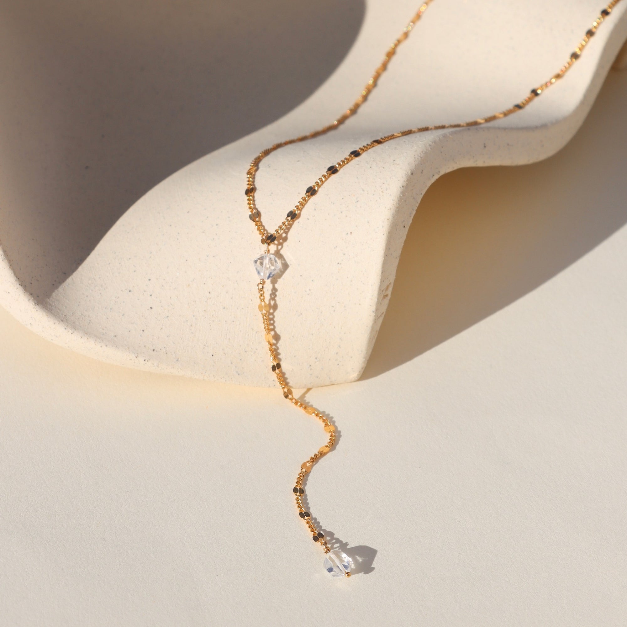 Gold-filled lariat necklace with Herkimer Diamonds and Sunburst chain links. Handmade and radiant for effortless everyday layering.