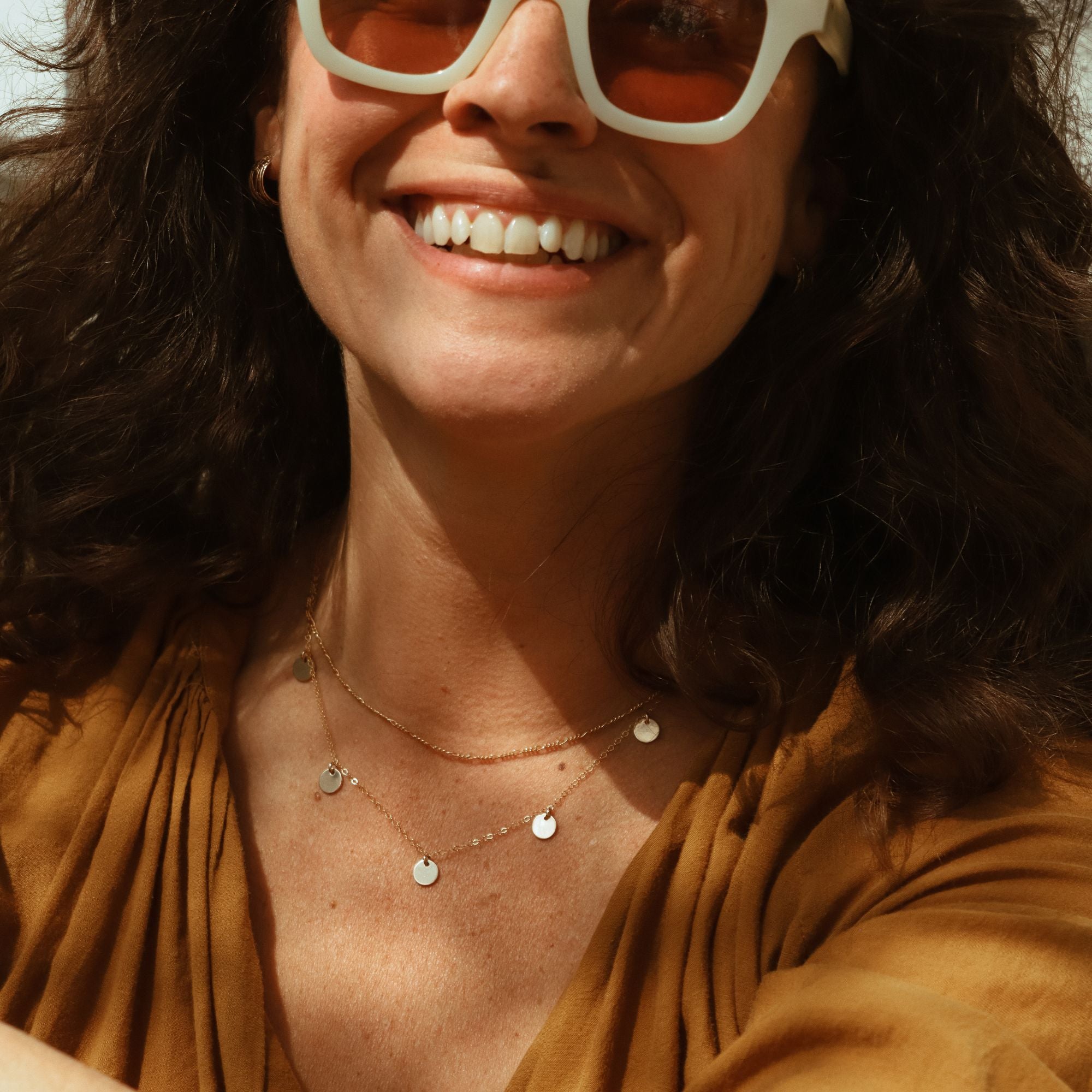 model wearing delicate figaro chain necklace with delicate chan necklace with round charms