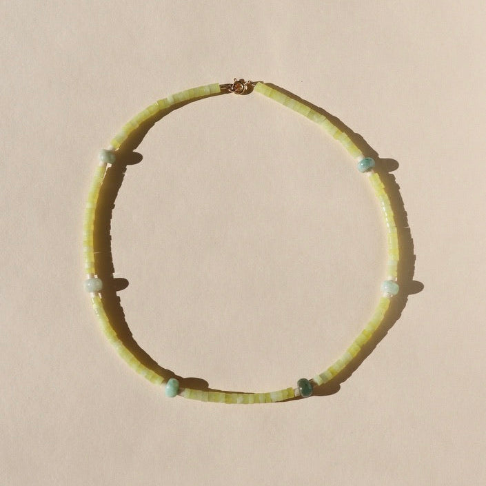 jade and jasper beaded necklace with 14k gold fill fixings on a light background