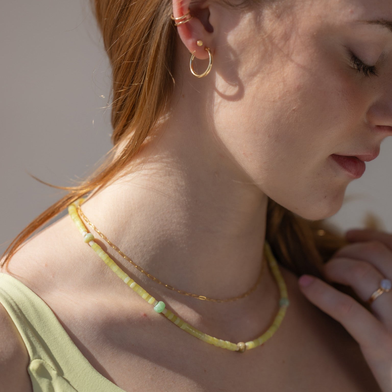 model wearing 14k gold fill chain necklace with Jade and jasper beaded necklace