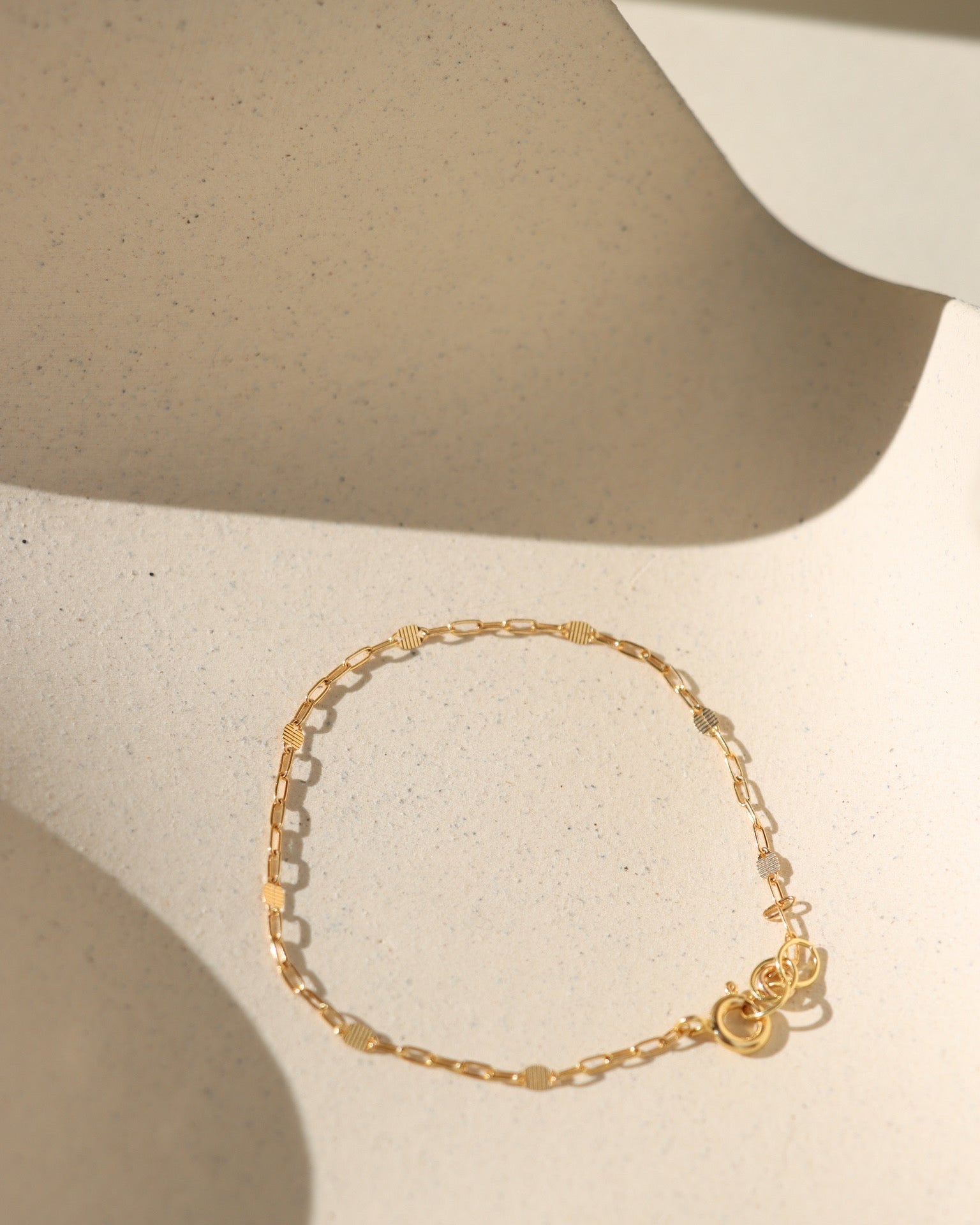 Sunspell Bracelet with softly textured links, available in 14k gold fill or sterling silver. Lightweight and comfortable, perfect for effortless layering and adding a subtle glow to any stack.