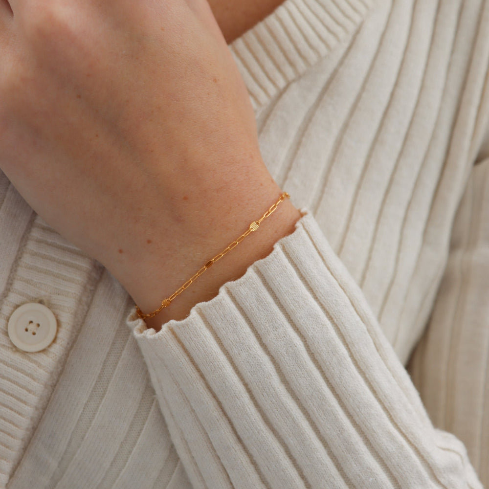 Sunspell Bracelet with softly textured links, available in 14k gold fill or sterling silver. Lightweight and comfortable, perfect for effortless layering and adding a subtle glow to any stack.