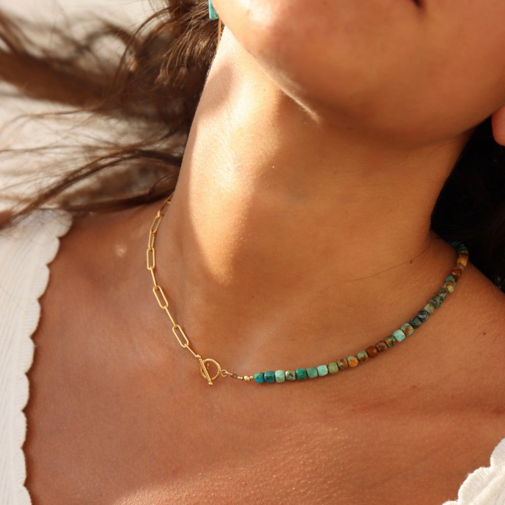 Model wearing the Taos Toggle Necklace, toggle clasp centered for a bold summer look.