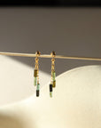 14k gold fill stud earrings with chain and tourmaline beads in the sunlight