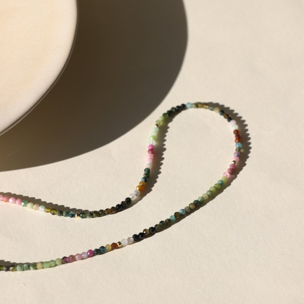 Tourmaline Beaded Necklace — mixed tourmaline beads in soft, earthy tones. Available in 14K gold fill or sterling silver, designed for effortless layering and everyday wear