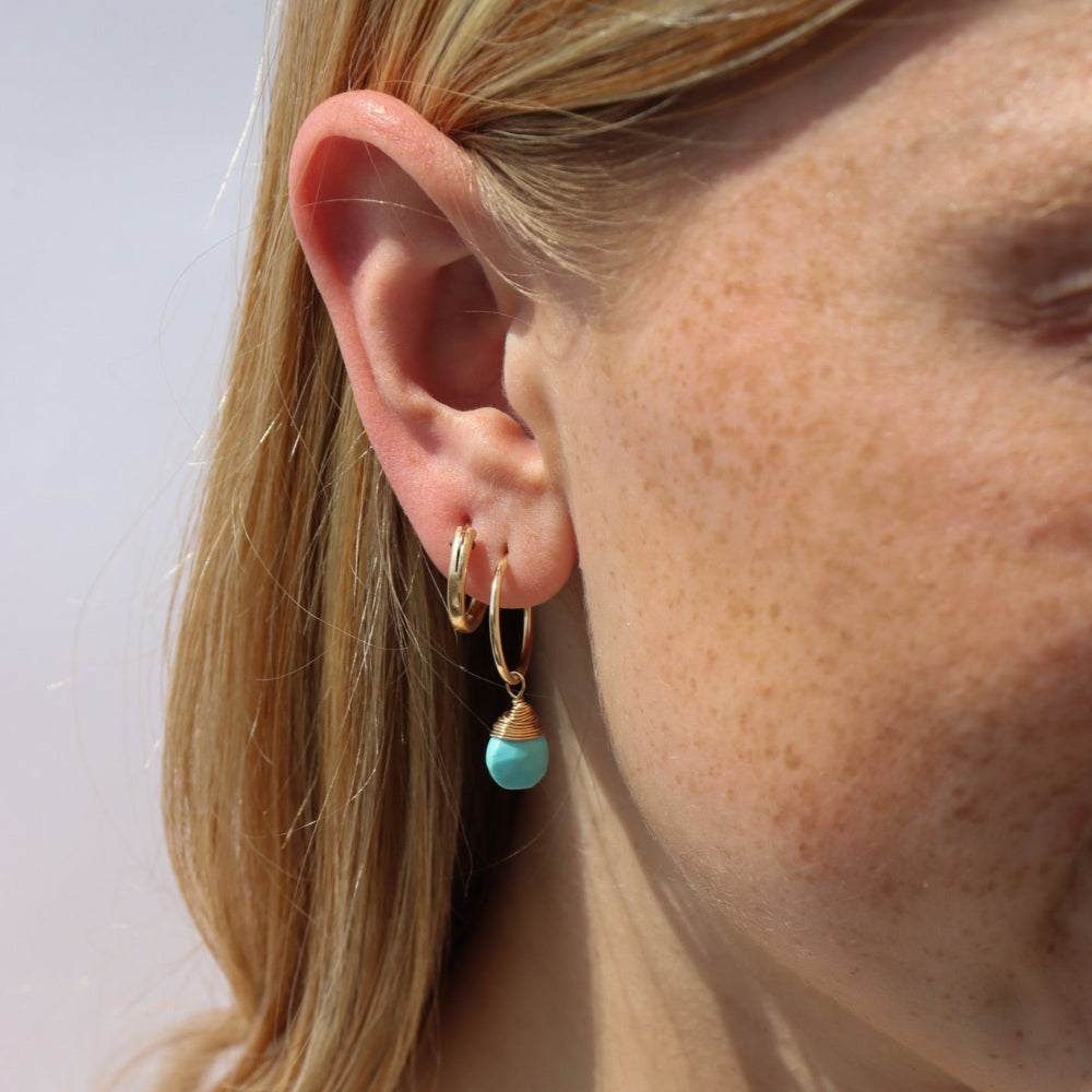 Model wearing Faceted turquoise gemstone charm for hoop earrings, shown with and without 16mm Goldie Hoops. A versatile Earring Bar add-on.
