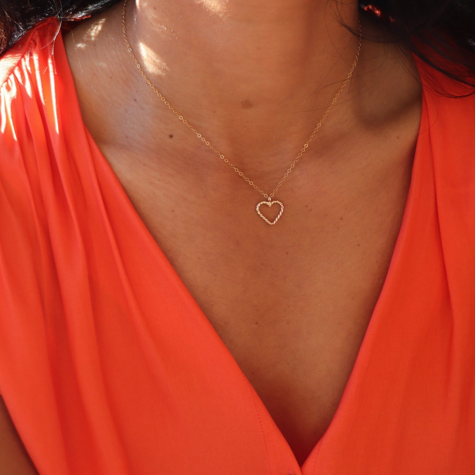 model wearing 14k gold fill spiral wire heart pendant necklace