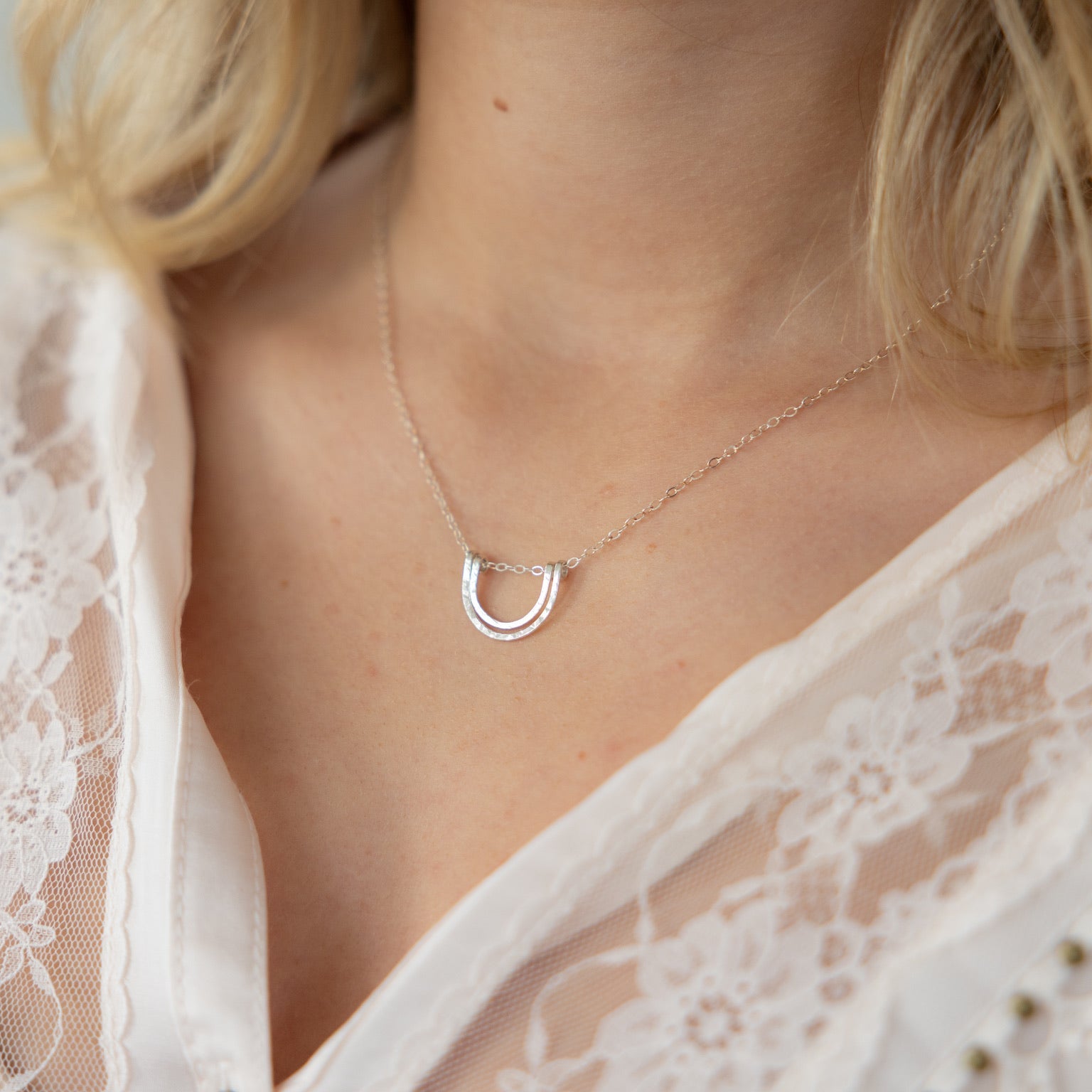 model wearing sterling silver hammered pendant necklace