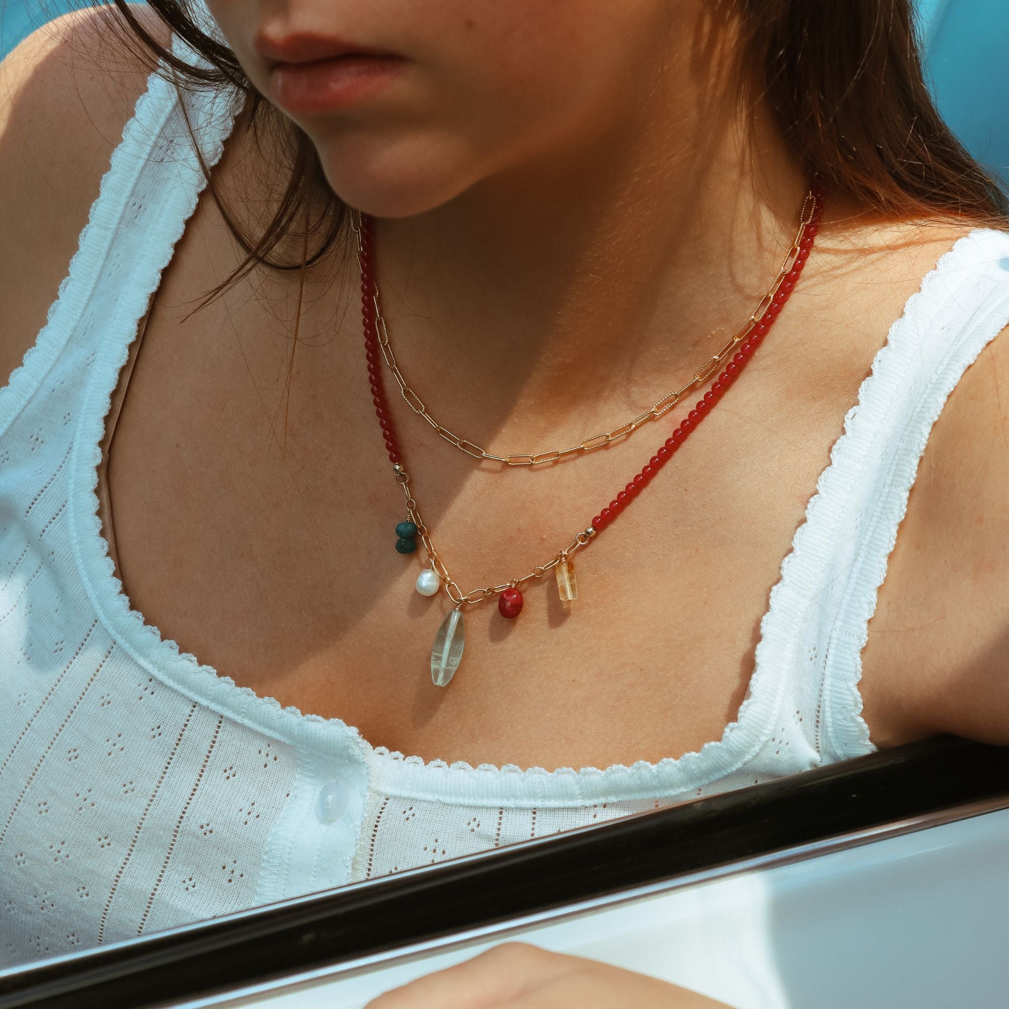 model wearing 14k gold fill chain necklace with beaded charm necklace