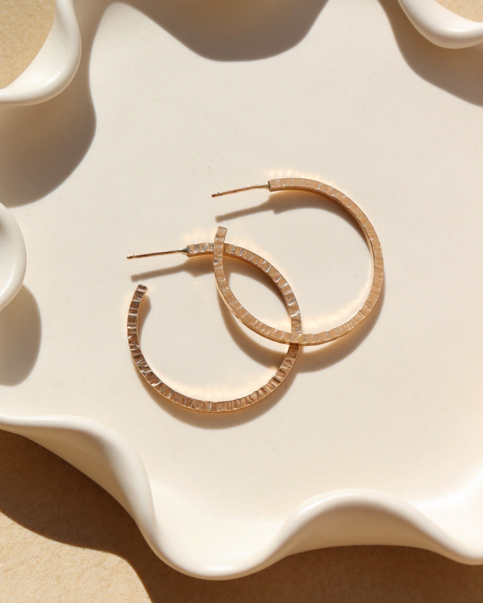 maeve hoops in 14k gold fill by token jewelry