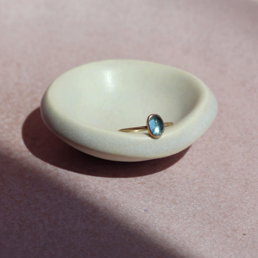 Blue Topaz Oval Ring - Oval cut blue topaz gemstone handset in an oval bezel. Shown in 14k gold fill. Also available in Sterling Silver. By Token Jewelry in Eau Claire, WI Gemstone Jewelry