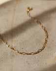 Feminine curvy chain linked bracelet in 14k gold fill. Spring hook clasp closure and half inch extender to make the bracelet adjustable. Handmade by Token Jewelry in Eau Claire, WI