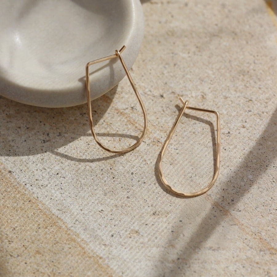 solid gold athena hoops, solid gold hoops, hand hammered solid gold, handmade jewelry, made in the USA, made in wisconsin, woman owned business, classic hoops, classic gold hoops, effortless jewelry, timeless gold jewelry  Edit alt text