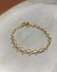 Modern 14k Gold Fill chain Bracelet with oval links and clasp closure. Fashion jewelry handmade by Token Jewelry in Eau Claire, WI