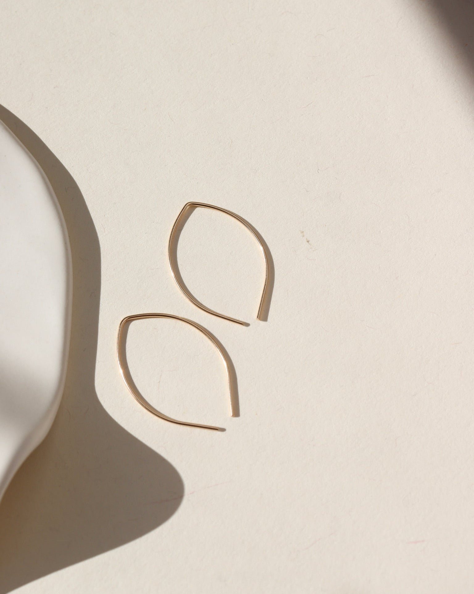 14k gold filled petal earrings in sun.