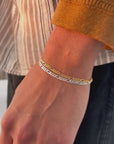 Model wearing 925 sterling silver and 14k gold fill Gio braclelet.